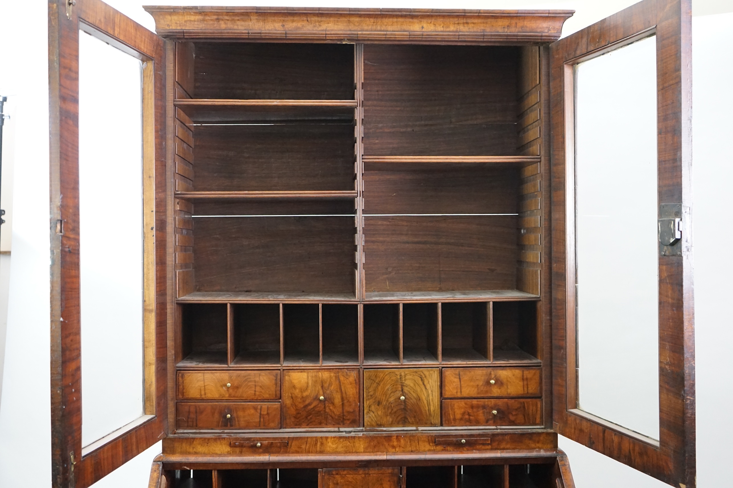 An early 18th century walnut bureau bookcase